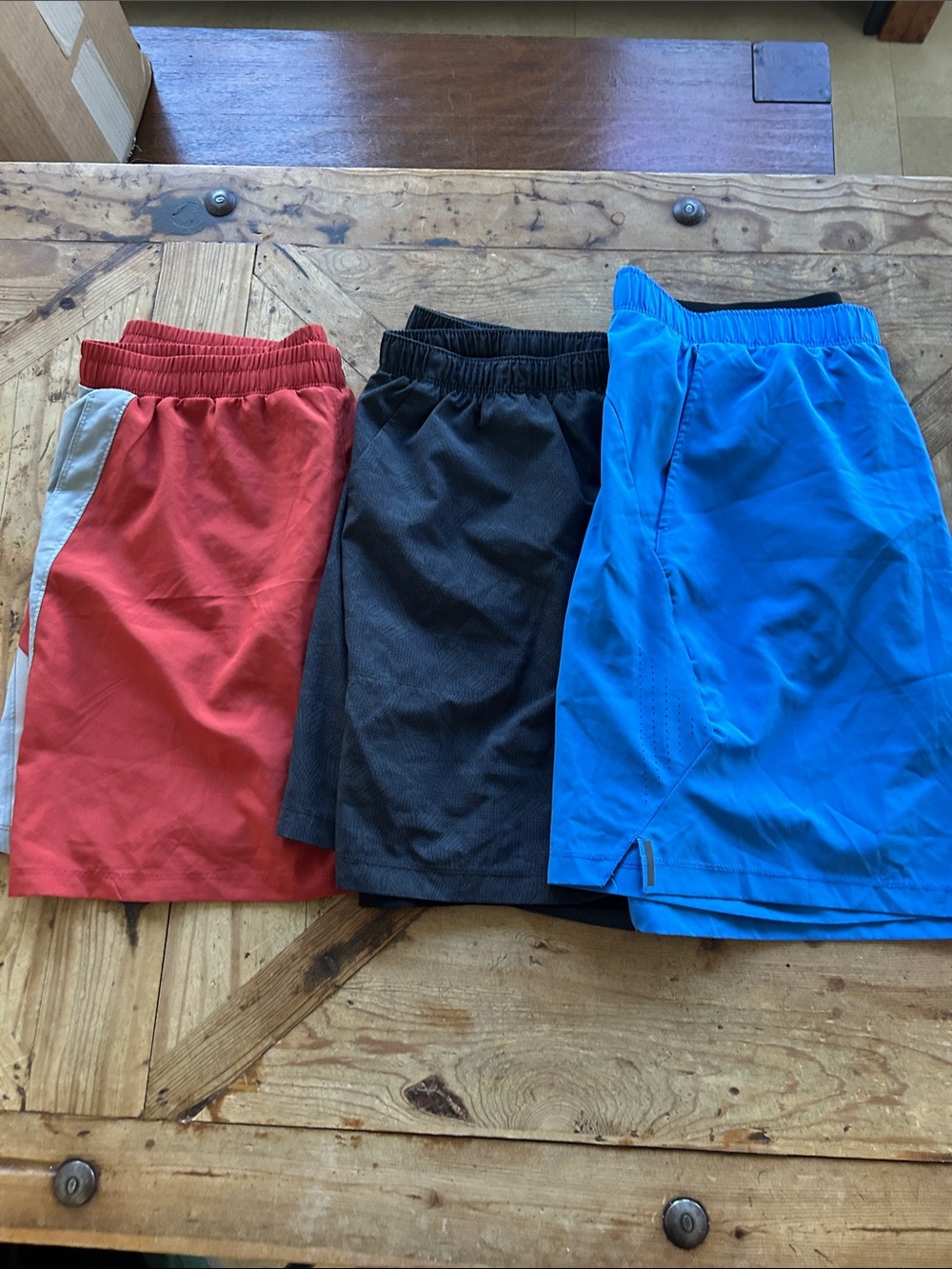 Bundle of Three ASICS XL running shorts.